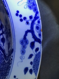A pair of Chinese blue and white basins with figures in a garden, Yongzheng