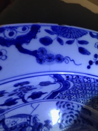 A pair of Chinese blue and white basins with figures in a garden, Yongzheng