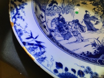 A pair of Chinese blue and white basins with figures in a garden, Yongzheng