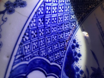 A pair of Chinese blue and white basins with figures in a garden, Yongzheng