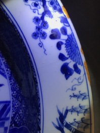 A pair of Chinese blue and white basins with figures in a garden, Yongzheng
