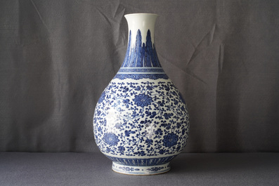 A Chinese blue and white 'peony scroll' bottle vase, Qianlong