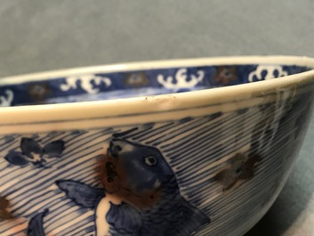 A Chinese blue and underglaze red bowl with carps and marine animals, Xuande mark, Kangxi