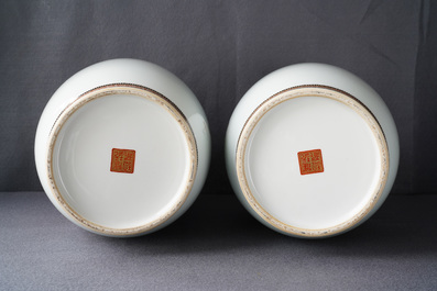 A pair of Chinese iron red, grisaille and gilt vases, Qianlong mark, 20th C.