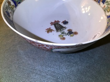 A Chinese famille verte plaque with playing boys and a landscape bowl, Kangxi