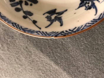 A pair of Chinese blue, white and underglaze red cups and saucers, Kangxi