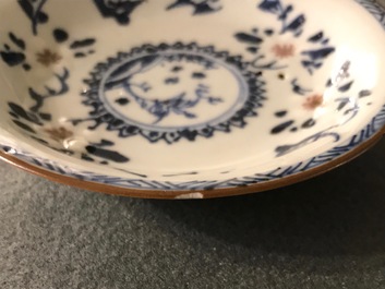 A pair of Chinese blue, white and underglaze red cups and saucers, Kangxi
