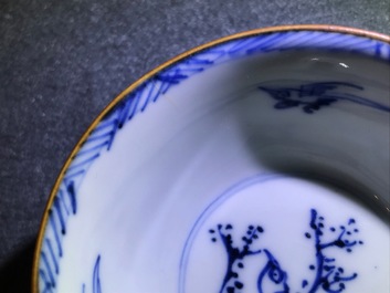A pair of Chinese blue, white and underglaze red cups and saucers, Kangxi