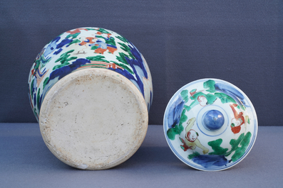 A Chinese wucai baluster vase and cover with playing boys, Transitional period