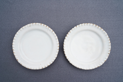 Four white Dutch Delft jugs, a pair of lobed plates and a large shaker, 17/18th C.