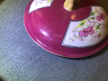 A Chinese famille rose ruby-ground two-handled bowl and cover, Yongzheng