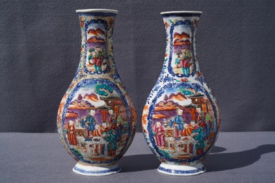 A pair of Chinese famille rose 'mandarin' vases, Qianlong