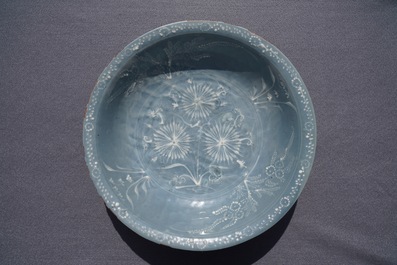 A Chinese Swatow celadon slip-decorated blue-ground dish, Ming