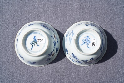 A pair of Chinese blue, white and underglaze red cups and saucers, Kangxi