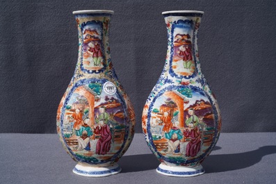 A pair of Chinese famille rose 'mandarin' vases, Qianlong