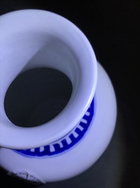 A Chinese blue and white rouleau vase with qilins, Kangxi