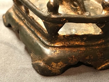 A Chinese gilt-lacquered bronze figure of Guanyin on a lotus throne, Ming