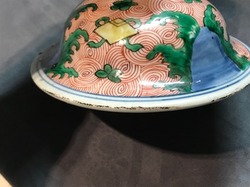 A pair of Chinese wucai 'galloping horses' vases and covers, Transitional period