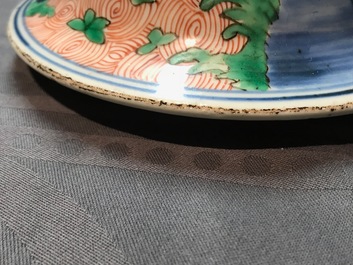 A pair of Chinese wucai 'galloping horses' vases and covers, Transitional period