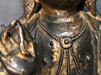 A Chinese gilt-lacquered bronze figure of Guanyin on a lotus throne, Ming