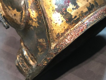 A Chinese gilt-lacquered bronze figure of Guanyin on a lotus throne, Ming