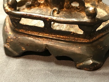A Chinese gilt-lacquered bronze figure of Guanyin on a lotus throne, Ming