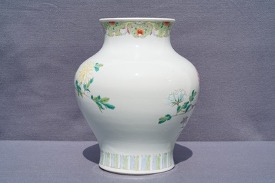 A Chinese famille rose vase with a bird on a flowering branch, 19th C.