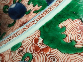 A pair of Chinese wucai 'galloping horses' vases and covers, Transitional period