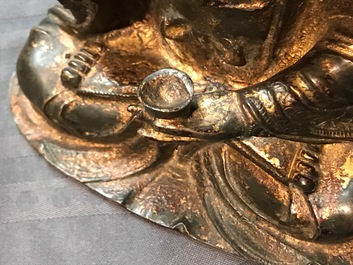 A Chinese gilt-lacquered bronze figure of Guanyin on a lotus throne, Ming