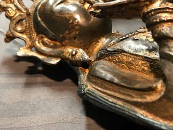 A Chinese gilt-lacquered bronze figure of Guanyin on a lotus throne, Ming