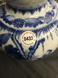 A Chinese blue and white double gourd vase, Transitional period