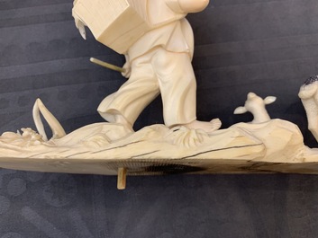 A polychrome Chinese ivory group with a shepherd, ca. 1940