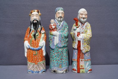Three Chinese famille rose figures of immortals, 19th C.