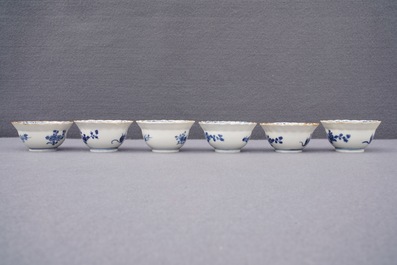Twelve Chinese blue and white cups and saucers with floral design, Kangxi/Qianlong