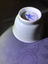 Six Chinese celadon and blue and white 'crabs and fish' cups and saucers, Kangxi