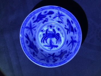 Six Chinese celadon and blue and white 'crabs and fish' cups and saucers, Kangxi