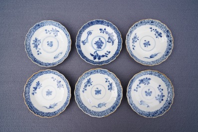 Twelve Chinese blue and white cups and saucers with floral design, Kangxi/Qianlong