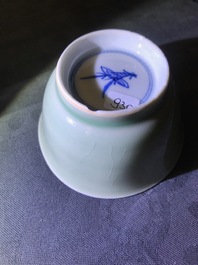 Six Chinese celadon and blue and white 'crabs and fish' cups and saucers, Kangxi
