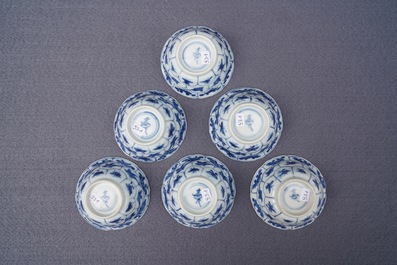 Twelve Chinese blue and white cups and saucers with floral design, Kangxi/Qianlong