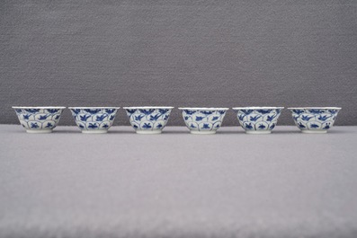 Twelve Chinese blue and white cups and saucers with floral design, Kangxi/Qianlong