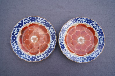 Four Chinese blue, white and iron red 'lotus' plates, Qianlong/Jiaqing