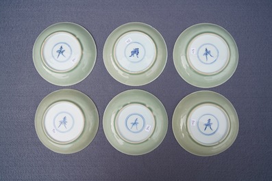 Six Chinese celadon and blue and white 'crabs and fish' cups and saucers, Kangxi