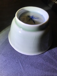 Six Chinese celadon and blue and white 'crabs and fish' cups and saucers, Kangxi
