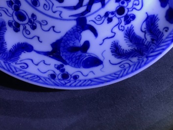 Six Chinese celadon and blue and white 'crabs and fish' cups and saucers, Kangxi