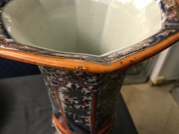 A Chinese blue and white vase with European clobbered decoration, Kangxi