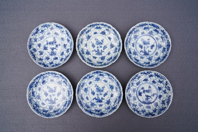 Twelve Chinese blue and white cups and saucers with floral design, Kangxi/Qianlong
