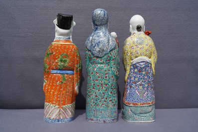 Three Chinese famille rose figures of immortals, 19th C.