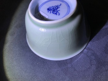 Six Chinese celadon and blue and white 'crabs and fish' cups and saucers, Kangxi