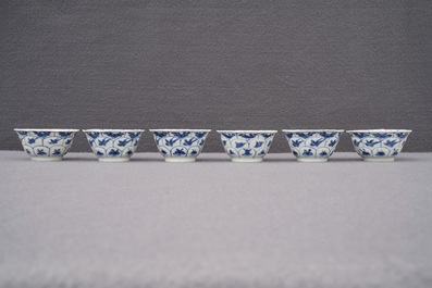 Twelve Chinese blue and white cups and saucers with floral design, Kangxi/Qianlong
