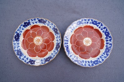 Four Chinese blue, white and iron red 'lotus' plates, Qianlong/Jiaqing